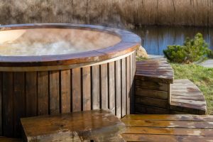 How,Water,Swirling,In,Wooden,Hot,Tub,Outside,In,Nature.